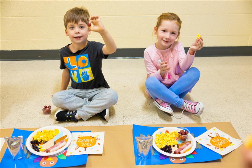 Students eat a Thanksgiving snack